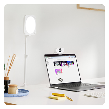 Clamp for Key Light Neo attached to a work desk near a laptop