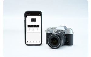 Fujifilm X-T50 camera with iPhone with Fujifilm xApp open