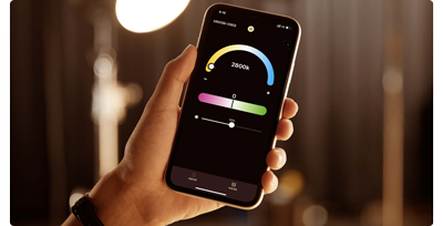 close up image of person holding iphone with godox smartphone application open