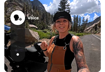 Female content creator standing road side with motorbike talking to camera