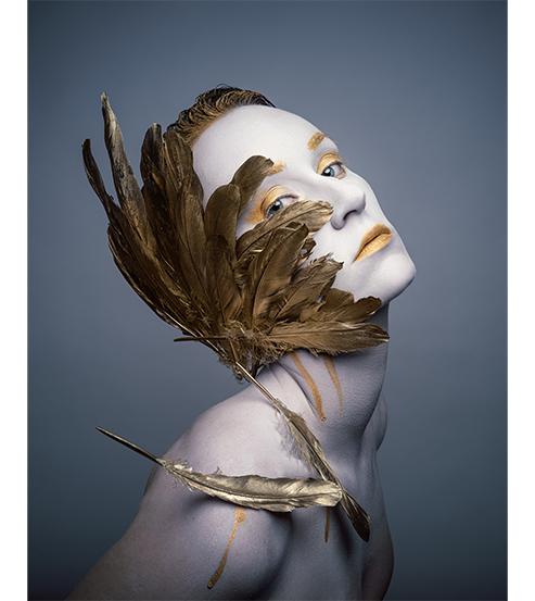 Hasselblad X2D 100C Sample Image of female model in white and gold body paint and ornemental gold leaves