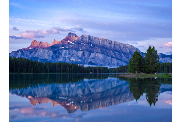 Hasselblad XCD35-75mm F3.5-4.5 Zoom Lens Sample Image of large clear lake with layered sandstone mountain in the background reflected across the water