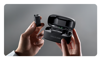 someone holding the Hollyland LARK MAX 2 out of the case
