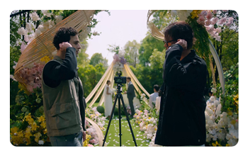 two cameramen using the Hollyland LARK MAX 2 at a wedding