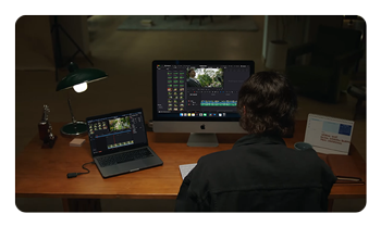 someone working a desk with footage taken using the Hollyland LARK MAX 2