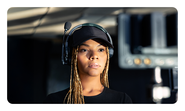 someone wearing the Hollyland Solidcom SE Pro headset in mute position