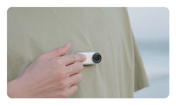 Insta360 Go 3S being pressed for quick capture mode