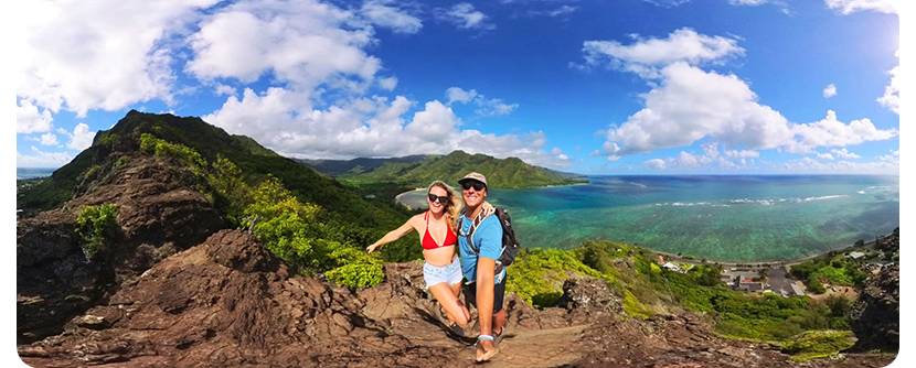 360 degree photograph of a couple looking out over the ocean from a mountain in hawaii
