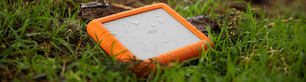 LaCie Rugged RAID Drive laid on grass