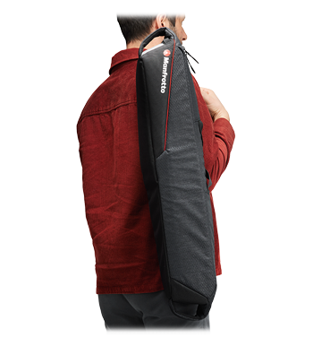 someone carrying the Manfrotto Pro Light Tripod Bag 69 over shoulder