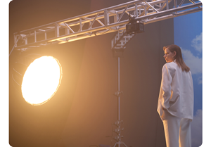 Nanlite Forza being used on set with from the left hand side to light a model on the right hand side of the frame.