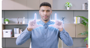 Person making L frame hand gestures recognised by OBSBOT Tiny 2