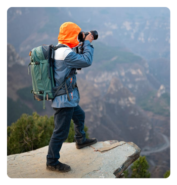 someone taking a photo on a mountian top