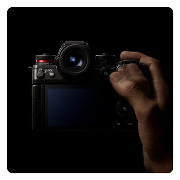 someone holding the Panasonic LUMIX S1II