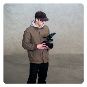 someone holding the Panasonic LUMIX S1II
