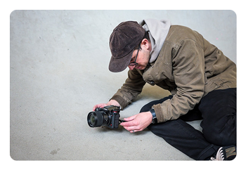 someone taking a photo with the Panasonic LUMIX S1II