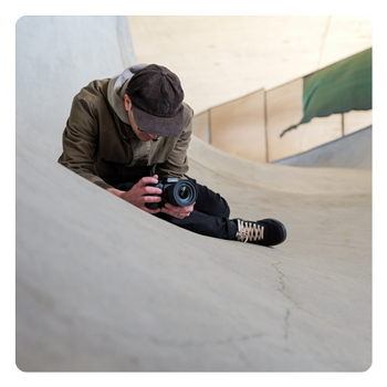 someone taking a photo using the Panasonic LUMIX S1II