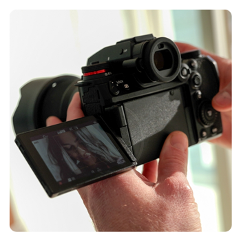 someone taking a portrait with the Panasonic LUMIX S1IIE