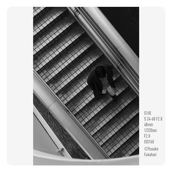 monochrome sample image of someone going down a set of stairs taken with the Panasonic LUMIX S1IIE