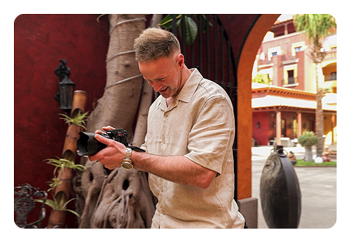 someone taking a photo using the Panasonic LUMIX S1IIE