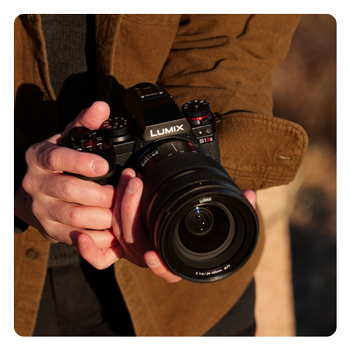 someone holding the Panasonic LUMIX S1IIE
