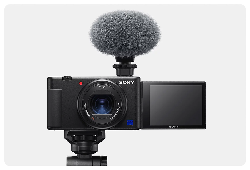 Sony ZV-1 Vlog Camera mounted on a tripod with external microphone