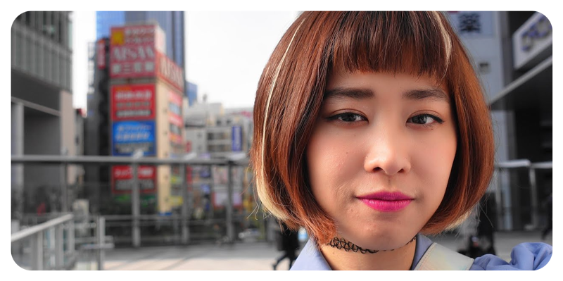Sony ZV-1 Vlog Camera sample photo of young asian woman with short brown bob hair style standing in tokyo street