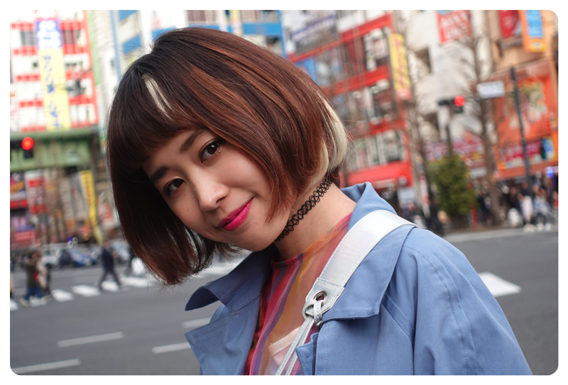 Sony ZV-1 Vlog Camera sample image of asian woman with short bob haircut standing in a tokyo street