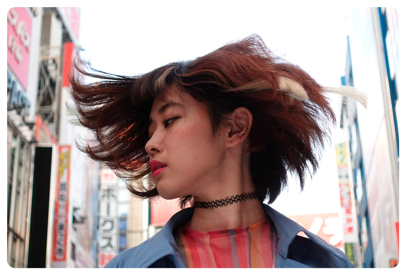 Young asian woman with short bob hair cut shaking hair, Sony ZV-1 Vlog Camera