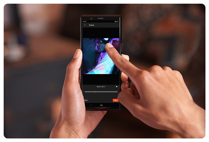 Person using Imaging Edge smartphone application to tag vertical videos for tiktok instagram reels
