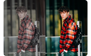 Split screen photo photo of a man stood infront of a buildings glass facade showing the difference in colour tones