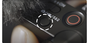 photograph showing the top of the ZV-E10 circling the slow motion button