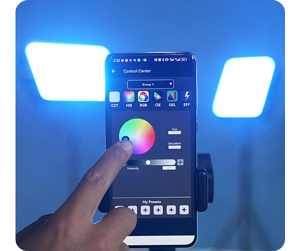 person using SWIT Console bluetooth application on apple iphone with blue light panels in background
