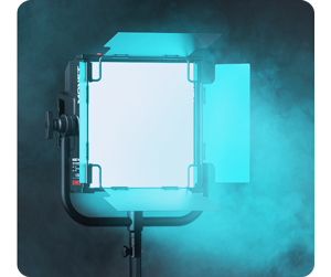 RGB LED panel light illuminating with a bright teal colour into smoke cloud