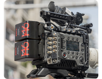 Two swit pocket batteries connected to Sony Cinema camera on film set