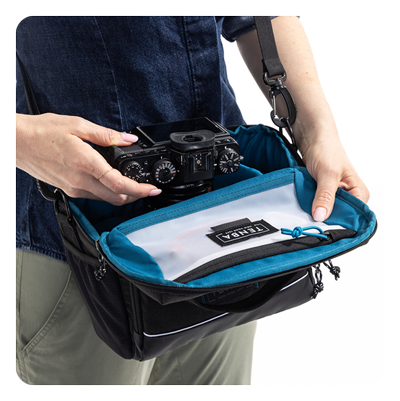 someone open the tenba skyline shoulder bag away from their body