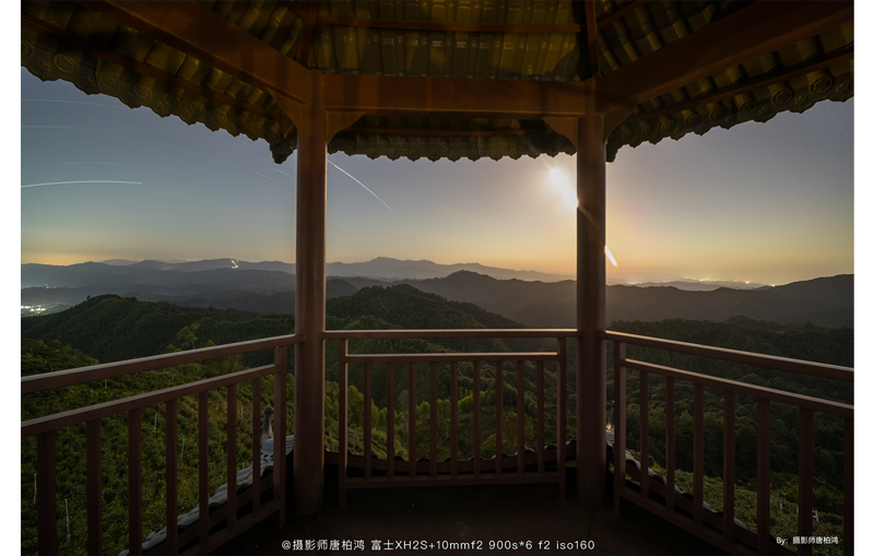 TTArtisan 10mm F2 ASPH sample long exposure photograph of view looking out from inside pagoda at a vast mountain rain and night sky