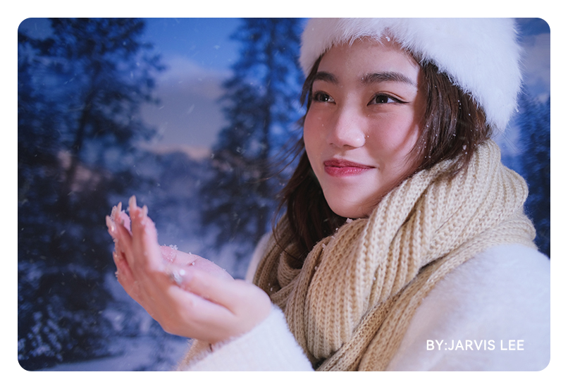 sample image of woman while it is snowing taken with the ttartisan 23mm f1.4 lens