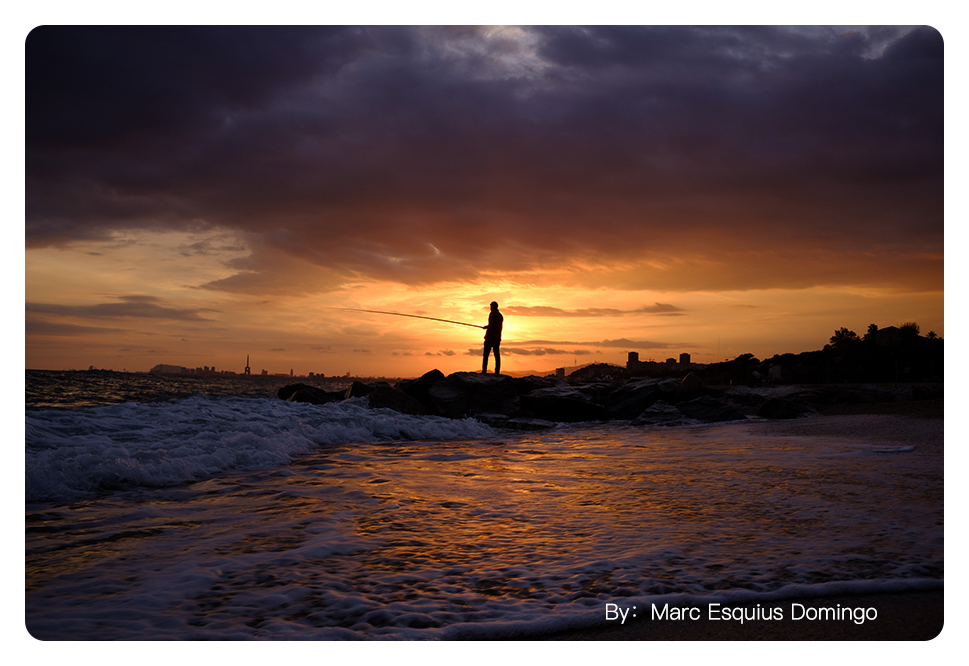 sample image of someone fishing on a shore at sunset taken with the ttartisan 23mm f1.4 lens