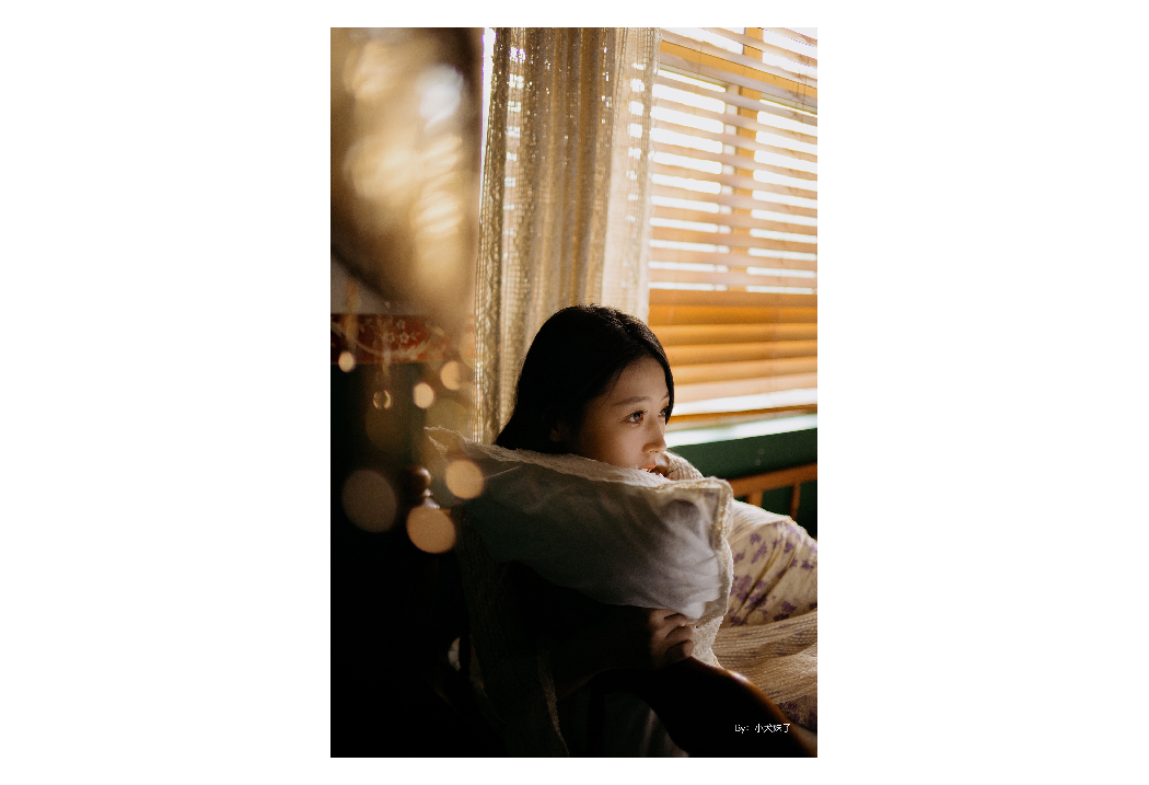 sample image of a woman lay down on a coach taken with the ttartisan 23mm f1.4 lens