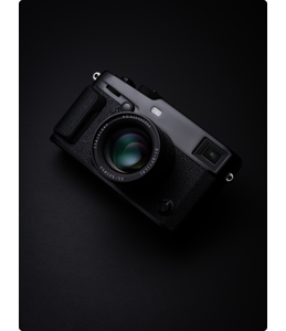 Photograph of Fujifilm XPro3 with TTArtisan 35mm f0.95 lens on black background