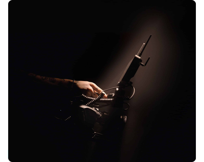 low light photograph of filmmaker with a built camera rig with Shogun Ultra