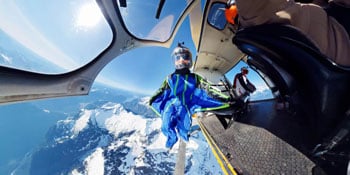 skydiver jumping out of plane door