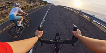 POV footage of road cyclists on coastal highway