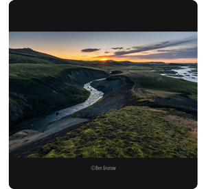 lumix s pro 16-35mm sample image of a river winding through a green hilly landscape at sunset