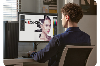 Designer working on artwork while sat at ProArt display and workstation