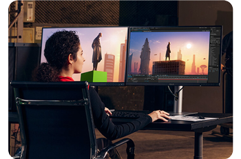 Editor working on superhero film using two ProArt monitors