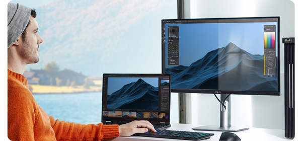 image of photographer editing using laptop and ASUS ProArt monitor