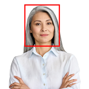 photograph of older asian woman with grey hair wearing white button shirt with red tracking marker surrounding her head