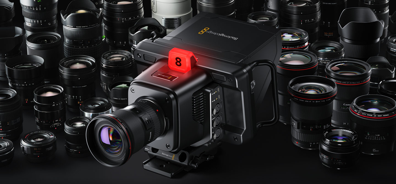hero image of the blackmagic studio camera 6k pro surrounded by compatible lenses on a black background